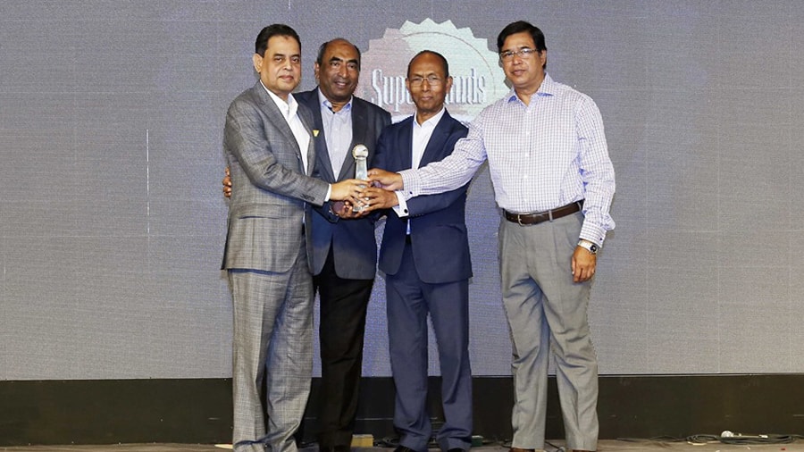 BGMEA President Siddiqur Rahman (left) accepting the 'Superbrand' award at a gala ceremony held at Radisson Blu Water Garden Hotel, Dhaka, on September 1, 2018.